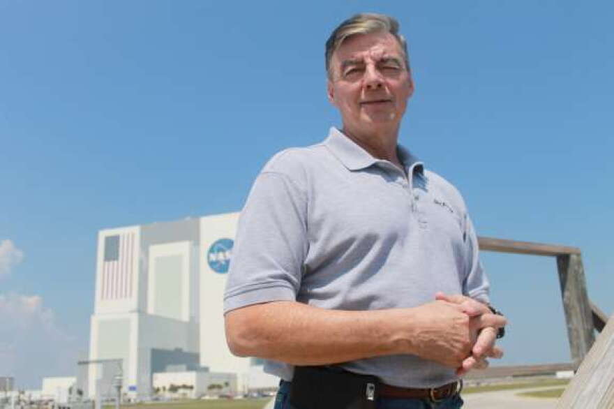 Space Day 2015 Chair Andy Allen stands in front of the Vehicle Assembly Building at Kennedy Space Center. Photo: Amy Green, WMFE
