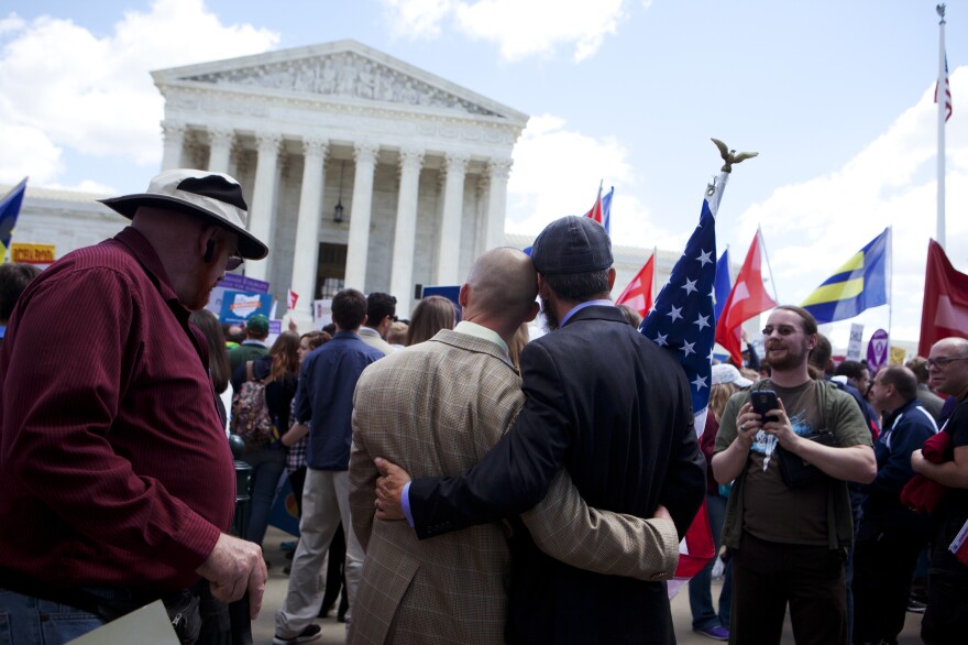 Frank and Joe Capley-Alfano embrace as the plaintiffs leave the Supreme Court on Tuesday. They were remarried in 2008 after their 2004 marriage license was voided by the California Supreme Court.