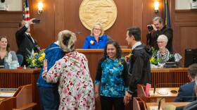 Newly sworn-in members of the Alaska House of Representatives — from left, Bryce Edgmon, I-Dillingham, Nellie Unangik Jimmie, D-Tooksook Bay, Robyn Niayuq Burke, D-Utqiagvik and Neal Foster, D-Nome — embrace after taking their oaths of office from Lt. Gov. Nancy Dahlstrom on Jan 21, 2025.