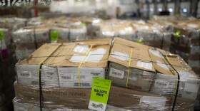 Pallets filled with Washington and Oregon mail-in ballots fill an unloading area at a U.S. Postal Service processing and distribution center on Oct. 14, 2020, in Portland, Ore.