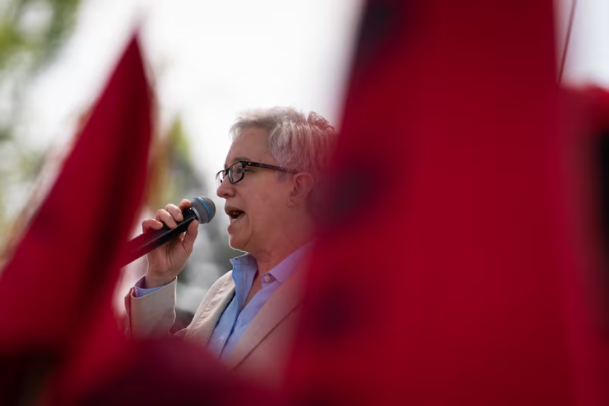 FILE - Oregon Governor Tina Kotek speaks to a crowd of hundreds during the Day Without an Immigrant demonstration at the Oregon State Capitol, Salem, Ore., on May 1, 2026.