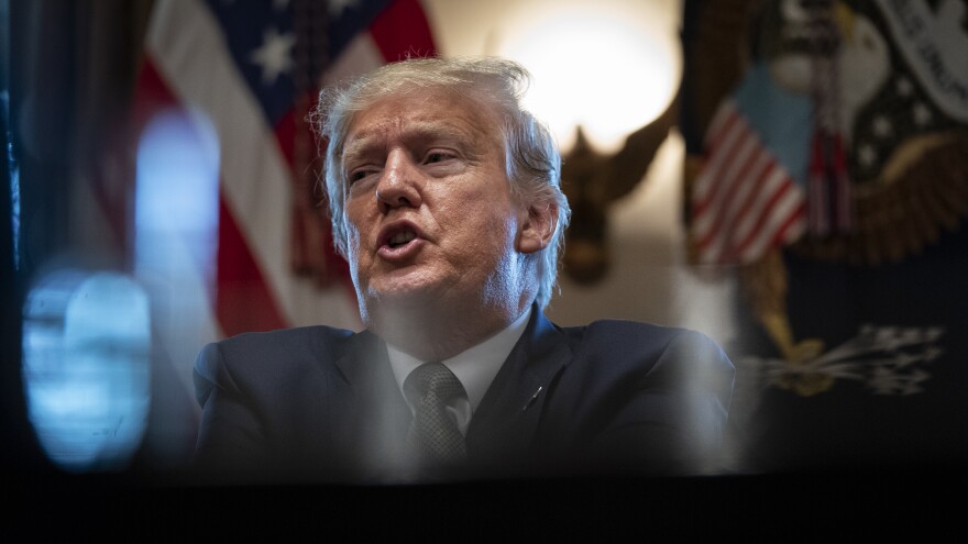 President Trump leads a meeting with travel and tourism industry executives at the White House on Tuesday to discuss the federal economic response to the coronavirus outbreak.
