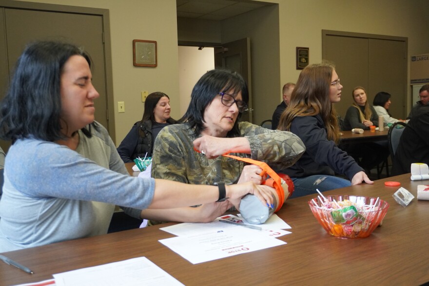 Members of the St. Marys and surrounding community take part in a "Stop the Bleed" course at the St. Marys Area Ambulance Service building. 