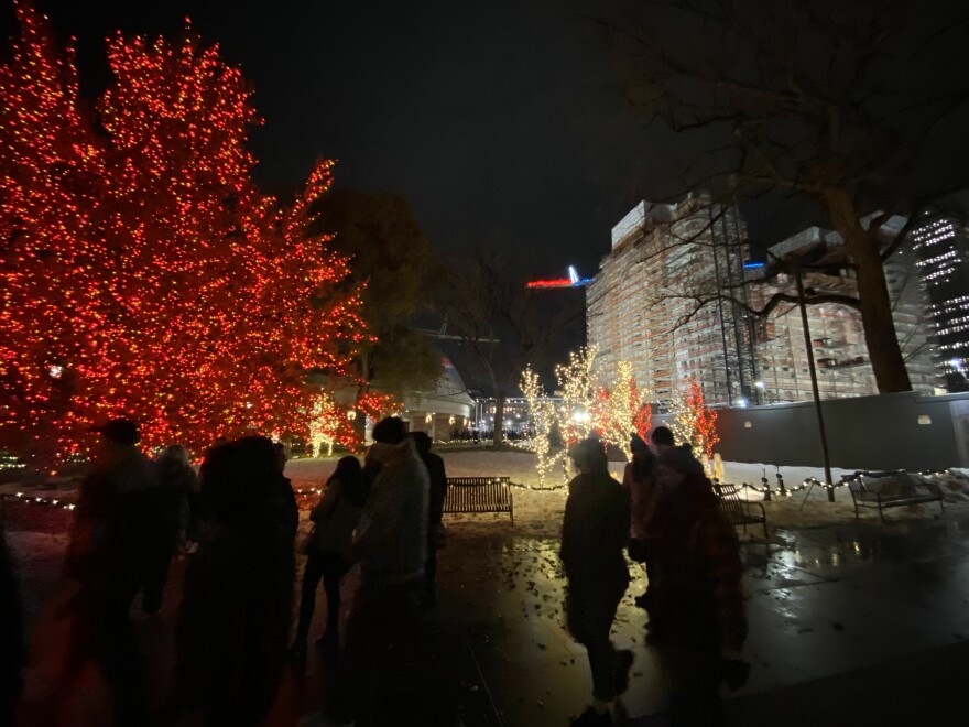 Visitors walking around Temple Square in Salt Lake City, looking at the annual Christmas light installation