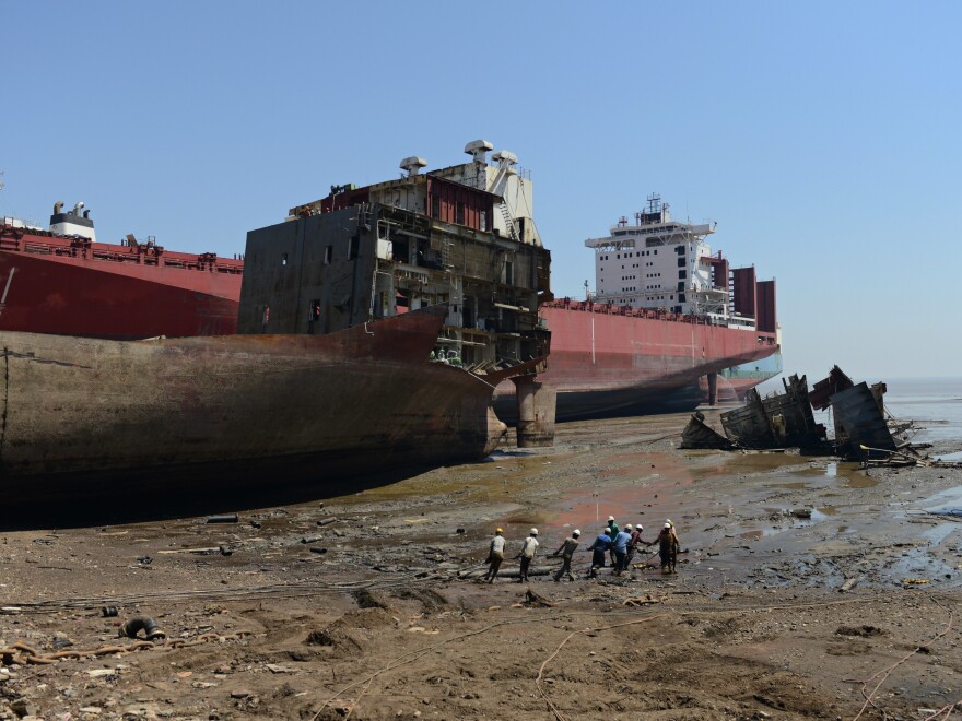 Indian shipbreakers work at the Sosiya-Alang Ship Recycling yard on March 4, 2013. Many ships are heading to scrap heaps, like this one, the world's largest, to help reduce the number competing for market share.