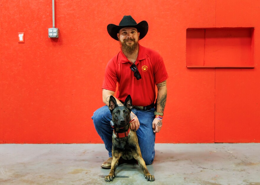 Devildog Canine co-founder Michael Parker with his dog, Padme.