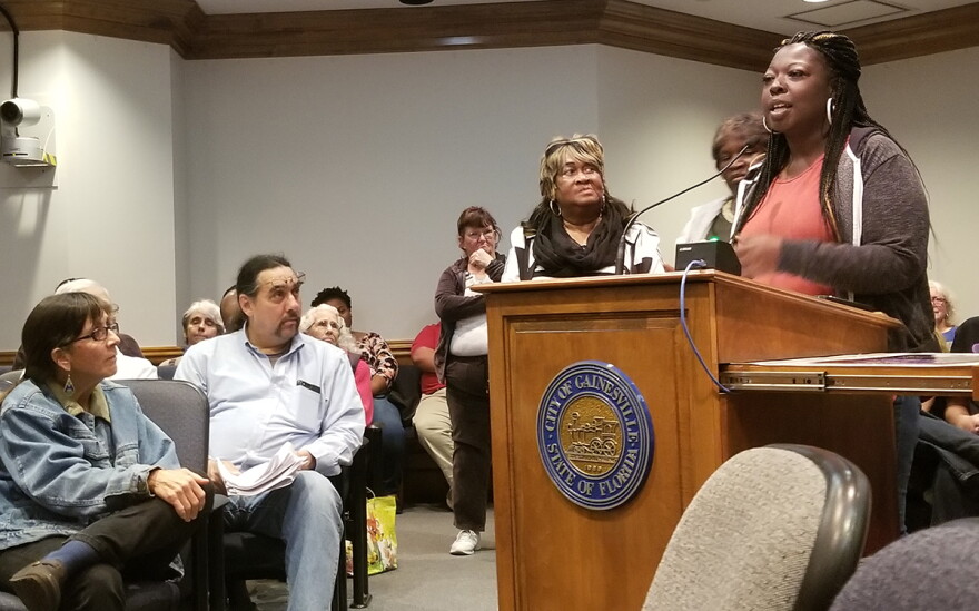 Crossing guard Pamela Miles explains to city commissions that crossing guards go beyond their job description to help the community. She said that one day, a boy came through her zone on a cold day without a jacket, so she found him one to warm himself.