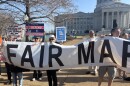 Protestors hold a sign outside of Missouri's Supreme Court on March 10, 2026. The protest was organized by People Not Politicians, a group currently working to get Missouri's redistricted map on November's ballot.