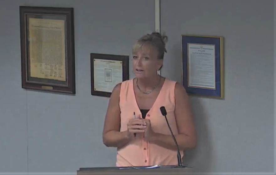 Elementary school teacher Courtney Franklin rushed over after the first day of school to urge the Lake County School Board not to close in-person school after a judge restore their authority to do that. Image: LCPS