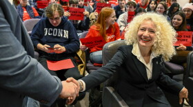 FILE: UConn president Radenka Maric greets attendees prior to testifying in at an Appropriations Committee meeting, Feb., 2023, in the Legislative Office Building about the proposed state budget cuts to UConn funding.