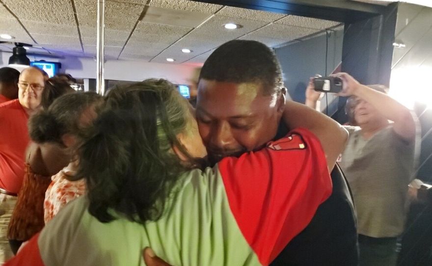 Springfield City Councilor Justin Hurst, a candidate for mayor, hugs a supporter during his preliminary election night party, September 12, 2023.