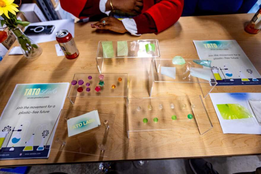 A presenter displays plastic made from potatoes at Greentown Labs (Jesse Costa/WBUR)
