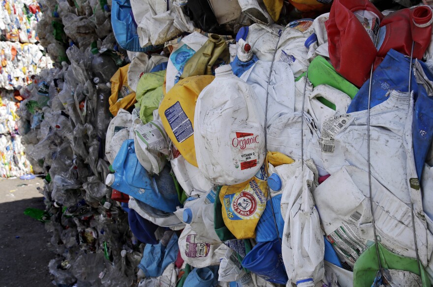 Bundled plastic goods, which were separated from paper and metal recyclable materials, are stacked and awaiting processing at EL Harvey & Sons, a waste and recycling company, in Westborough, Mass., on Sept. 6, 2018.