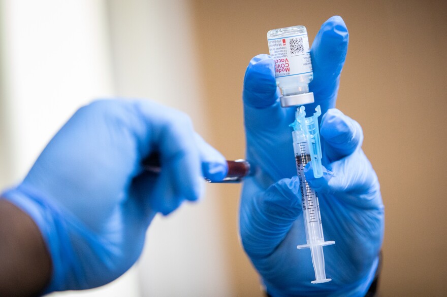 A Moderna COVID-19 vaccine is prepared during a pop-up vaccine clinic at Cristo Rey Church in East Austin on July 24, 2021.