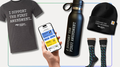 a collage image showing a t-shirt that reads "I support the first amendment," a hand holding a phone with the New York Times Games app loaded, a water bottle with "I support the first amendment" on it, and a beanie hat and pair of socks