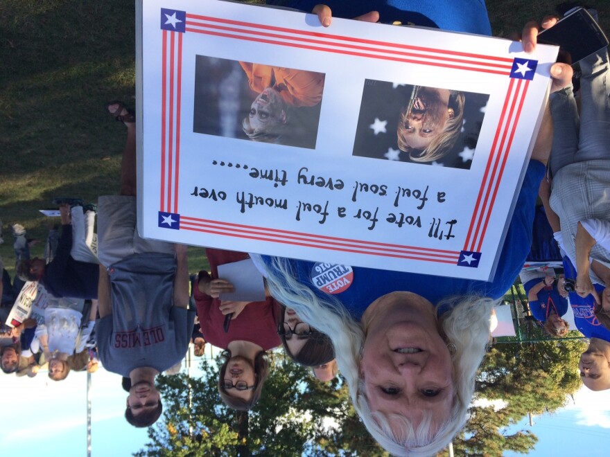 A Donald Trump supporter shares her sign on Washington University ahead of the debate on Sunday night.