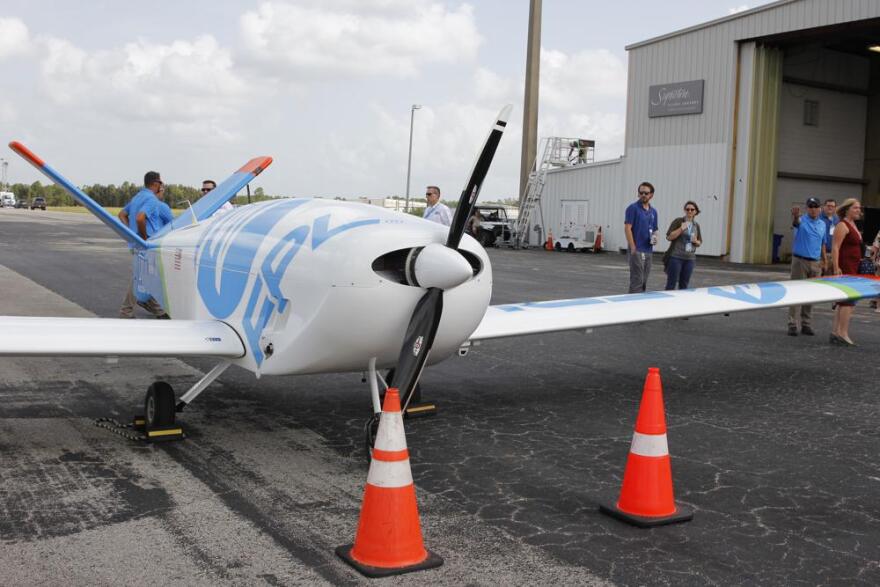 Florida Power and Light unveils its new fixed-wing drone designed to fly into tropical storm force winds to help expedite power restoration, Wednesday, Aug. 10, 2022, West Palm Beach, Fla. The company says a drone of this scale is the first of its kind to be used outside of an FAA test site for research and development. The drone, named FPLAir One, resembles a small plane that is remotely operated, allowing the company to scan and capture visuals for up to 1,000 miles on a single flight.