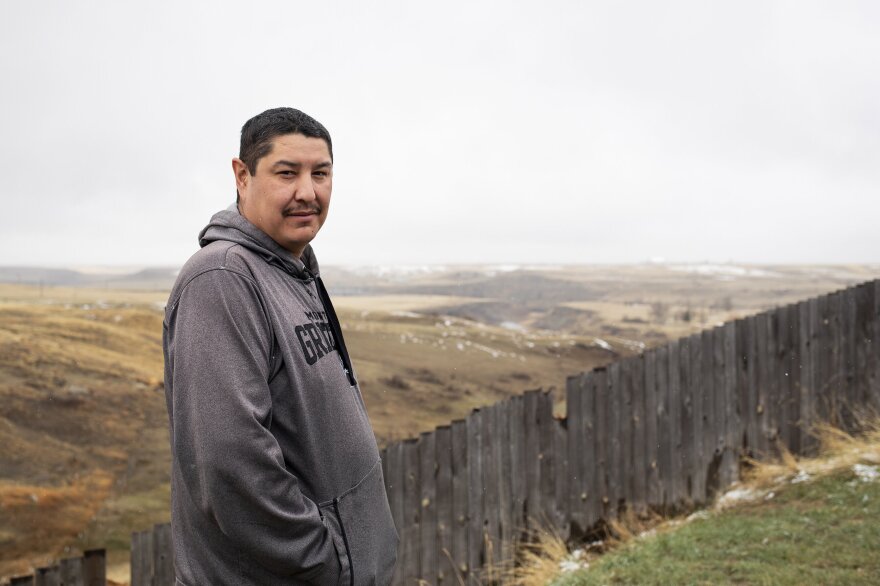 Keith Skunkcap stands for a portrait outside his home in Cutbank, Montana, on April 25, 2021.