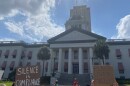 Protesters holding up signs in front of the capitol building on Jun. 1, 2020 in Tallahassee, Fla.