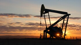 A Whiting Petroleum Co. pump jack pulls crude oil from the Bakken region of the Northern Plains near Bainville, Mont. on Nov. 6, 2013