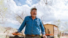 Carlos Arguello is a commissioner on his acequia, the Acequia del Monte del Río Chiquito. Here he stands in front of the headgate on the acequia on his property near Taos, New Mexico.
