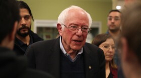 Sen. Bernie Sanders of Vermont greets people during a campaign event in Winterset, Iowa, on Dec. 30. His campaign announced on Thursday that it had raised $34.5 million in the last fundraising quarter.