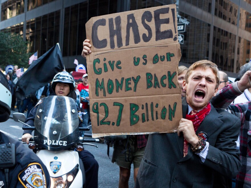 <p>As many as 1,000 Occupy Wall Street protesters marched to a Chase bank in New York's financial district to decry corporate greed.</p>