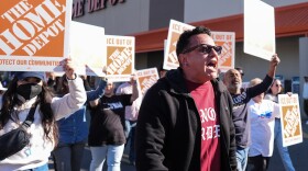 Organizing director for the National Day Laborer Organizing Network Jorge Torres, center, marches alongside protestors outside of a Home Depot, Wednesday, Nov. 19, 2025, in Charlotte, N.C.