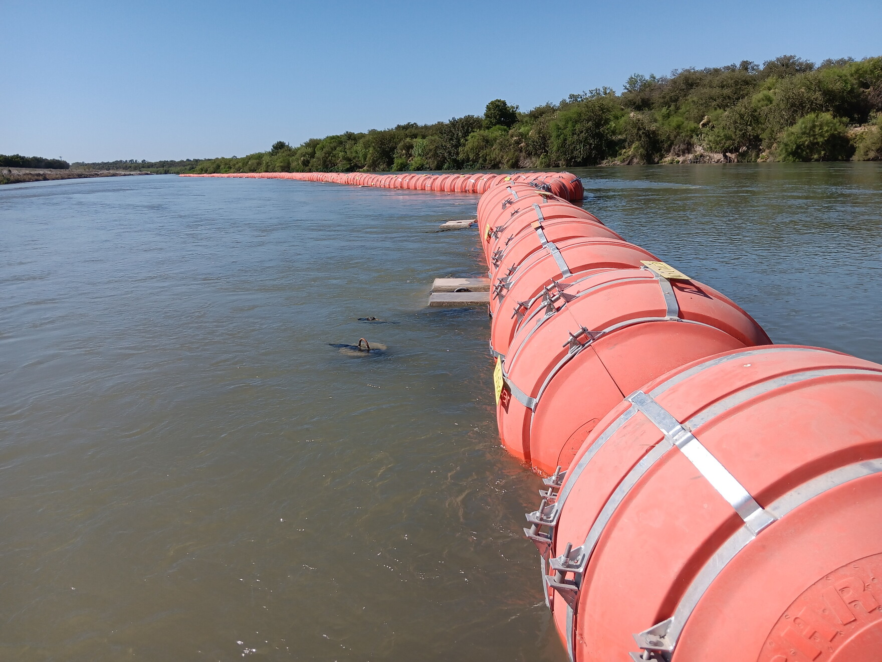 Up-close look at Gov. Greg Abbott’s floating wall in the Rio Grande | TPR