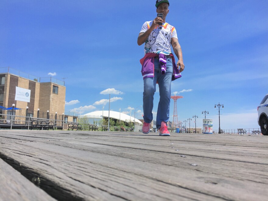 Stephon Marbury wears a pair of his Starbury sneakers on the Coney Island boardwalk.