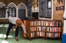 Freedom Reads Founder & CEO Reginald Dwayne Betts with a Freedom Library at Woodbourne Correctional Facility in New York.
