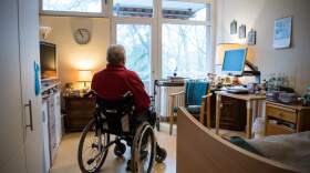 A resident sits in a wheelchair in his room in a nursing home. (Stefanie Loos/AFP via Getty Images)