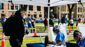 Keith J. DuPerry registers for his vaccination on the New Haven Green. The clinic was administered by Griffin Hospital.