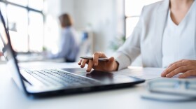 An office worker at her computer. 