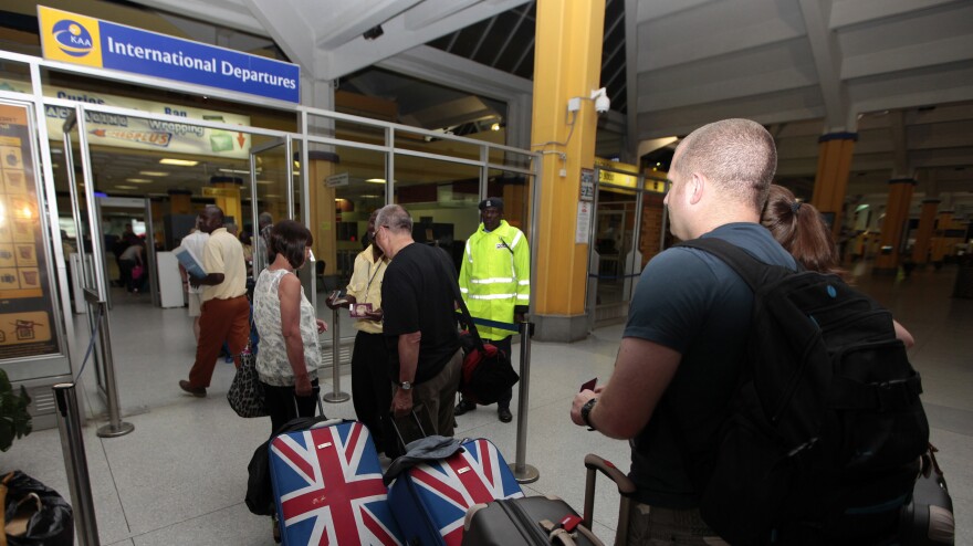 British tourists queue at a departure gate at Moi International Airport in the Kenyan coastal city of Mombasa, May 15. Hundreds of tourists were evacuated after Britain, the United States, Australia and France issued travel warnings for Kenya after a series of terrorist attacks.