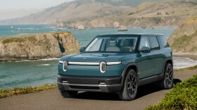 The new Rivian R2, parked along an ocean coast