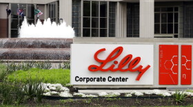 FILE - This is an April 26, 2017, file photo showing Eli Lilly corporate headquarters in Indianapolis. Eli Lilly continues to back a potential COVID-19 treatment despite research showing that it may not work on hospitalized patients. The drugmaker said Tuesday, Oct. 27, 2020, that It remains confident that its drug may stop COVID from developing in other patients.
