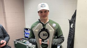 Cheli with the 2024 Big Ten Regular Season Championship Trophy.