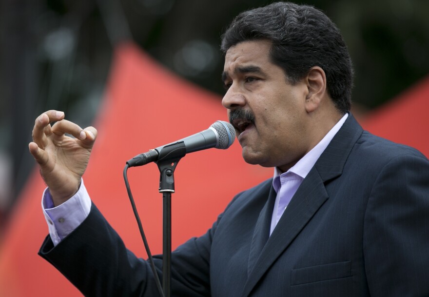 Venezuela's President Nicolas Maduro speaks outside the presidential palace after he met with U.S. diplomat Thomas Shannon on Wednesday. The opposition blames Maduro and his Socialist Party for the country's severe economic problems.