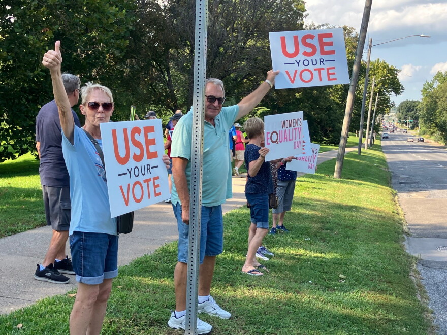 Protestors against the federal SAVE Act line Brady Street at Vander Veer Park, on Aug. 26, 2026.