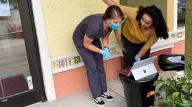 District manager Shelby Zellner, left, and office manager Antonia Trent prepare to pre-screen patients as they enter a Premier Medical Associates office in The Villages on Monday. Photo: Joe Byrnes