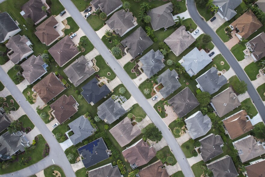An aerial view shows homes 