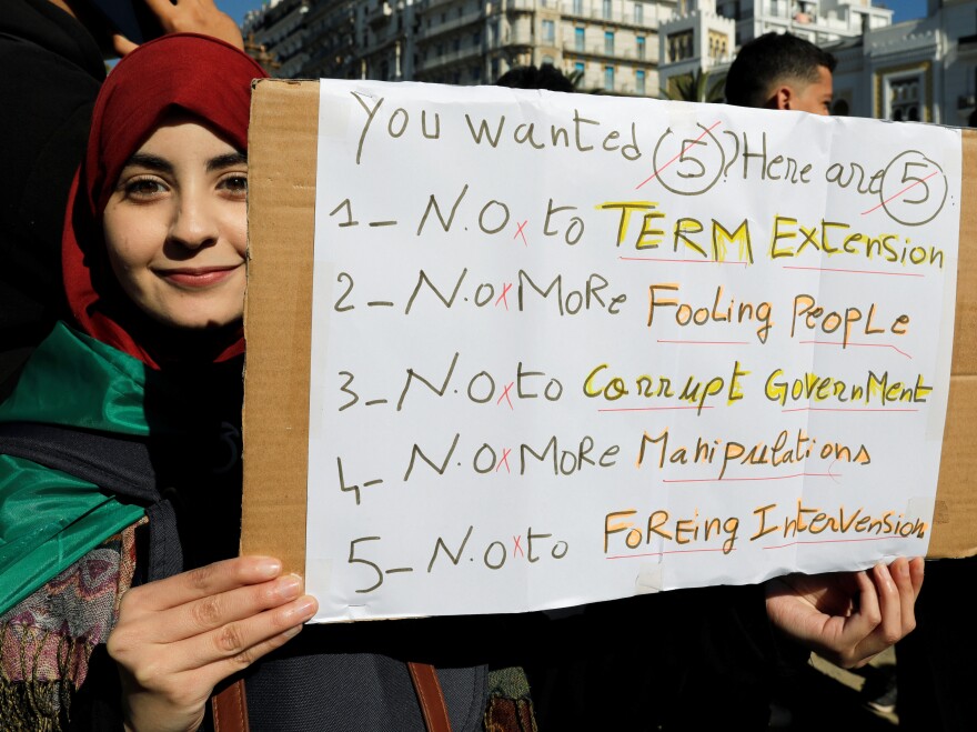 A student holds a banner during a protest against Algerian President Abdelaziz Bouteflika in Algiers on Tuesday.