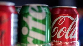 Cans of Coca-Cola products are displayed for sale at Hawthorne Market on Tuesday, Jan. 6, 2026, in Portland, Ore.