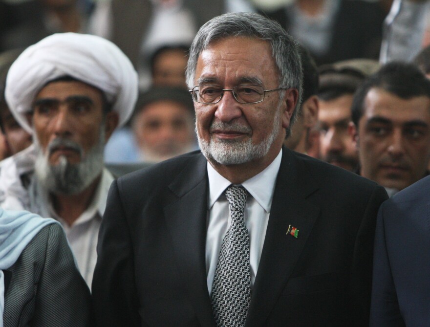 Candidate Zalmai Rassoul (center) is a former foreign minister.