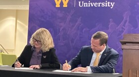 Kristi Mindrup, president of Western Illinois University, and Jeremy Thomas, president of Black Hawk College, sign a renewed partnership agreement between the two schools at the BHC Moline campus Wednesday, April 1, 2026.