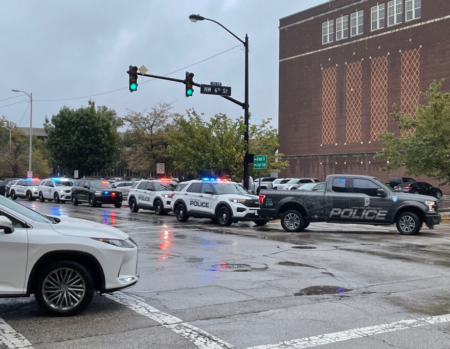 Numerous police vehicles parked on Sycamore St. behind the Victory Theatre investigating a threat to Signature School, Oct. 2, 2026