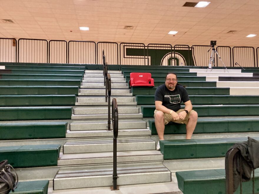 John Reinenger sits and waits for an unveiling ceremony of the new Bison logo at Oklahoma School for the Deaf in early October.