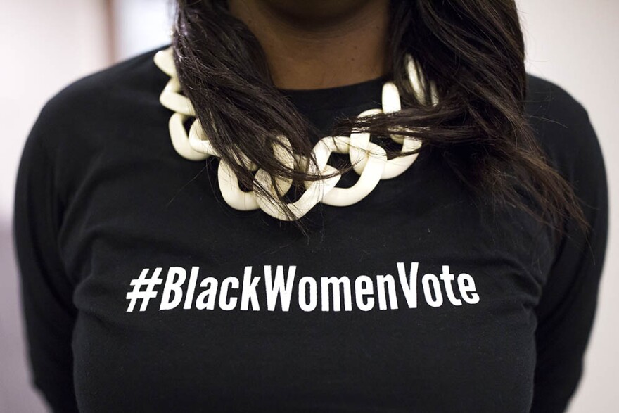 Natalie Murdock wears a #blackwomenvote shirt during a Sister to Sister salon conversation at the Chesterfield in Durham on Friday, October 26, 2018.