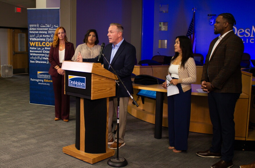 Members of the Des Moines School Board congratulate interim superintendent Matt Smith, who they just named permanent superintendent.